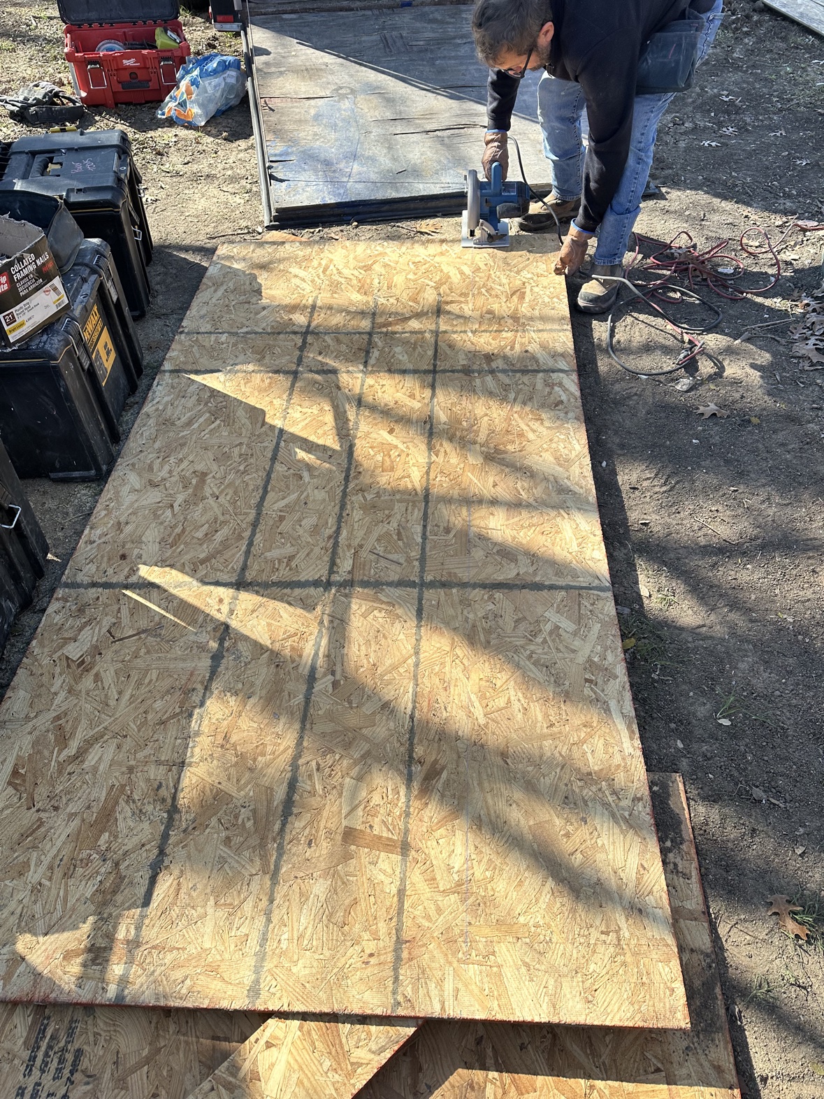 Carpenter cutting framing lumber with clean cuts, DFW job site