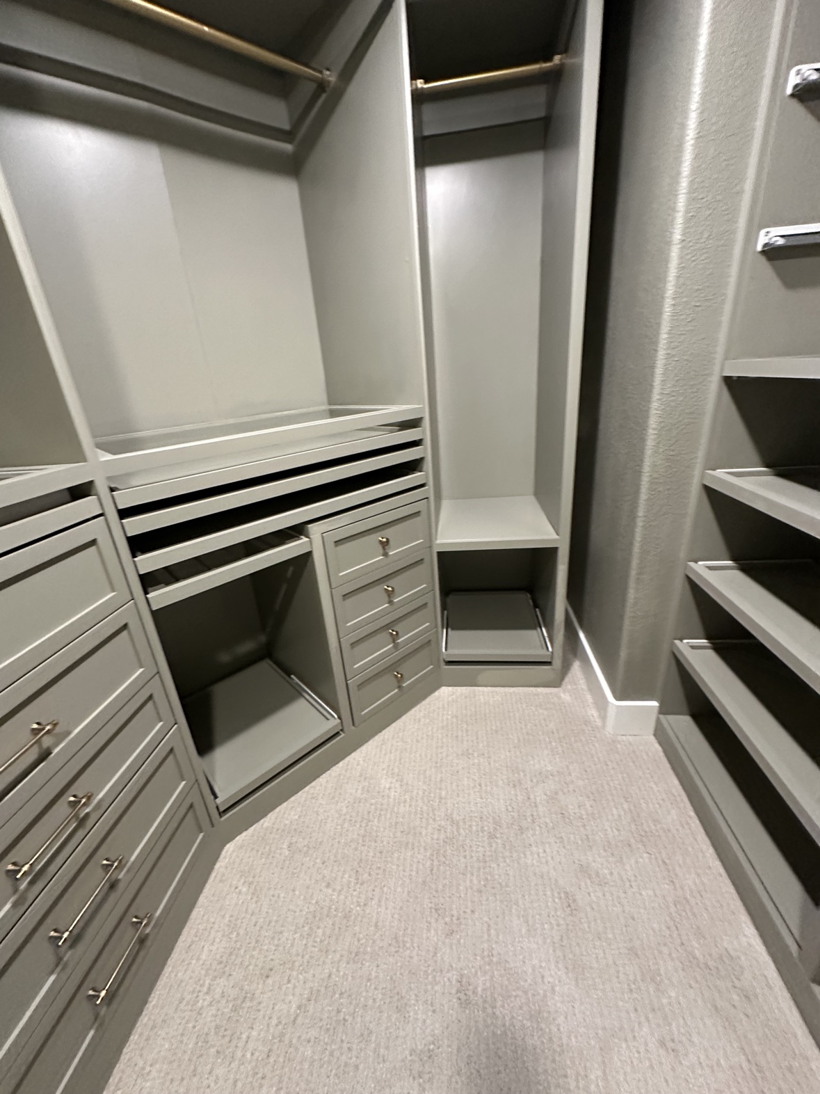 Custom closet wrapping a corner with shoe shelves, DFW closet builder