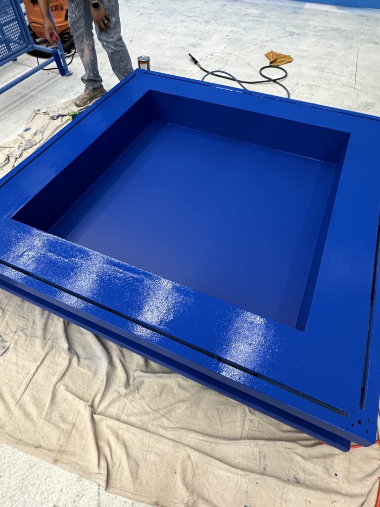 Finished glossy blue custom picture frame by Terra Renovations, Dallas-Fort Worth carpenter