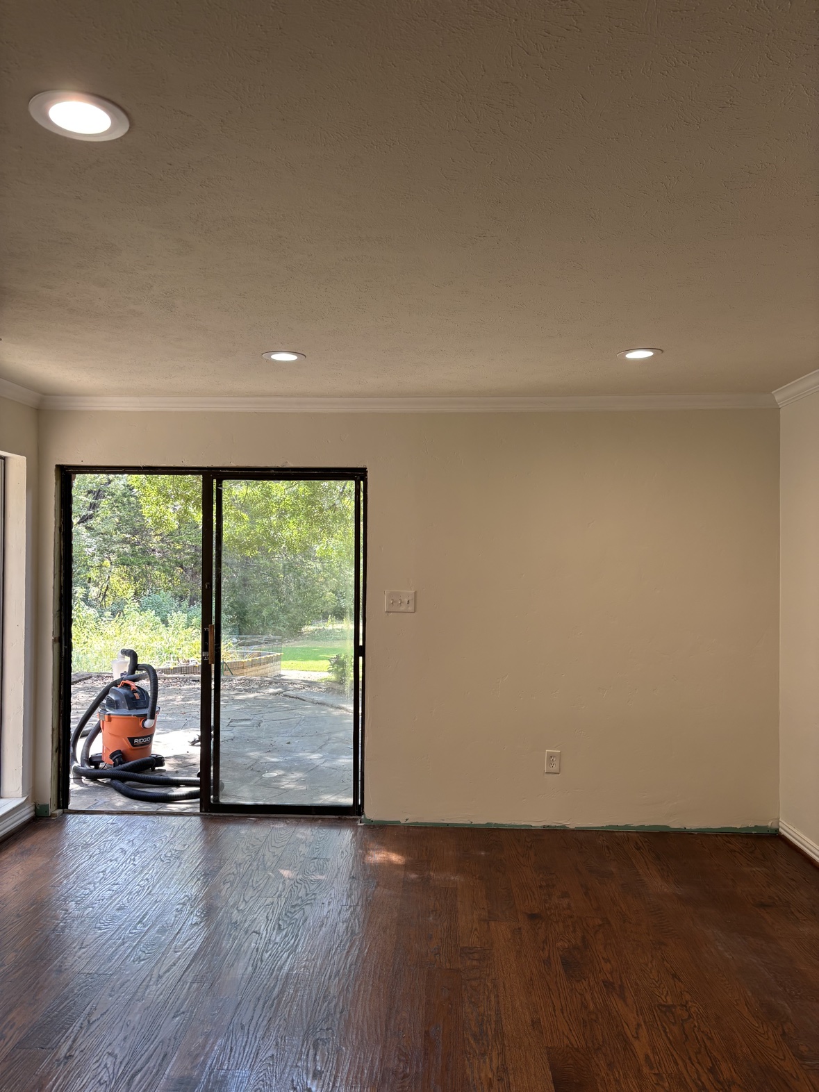Finished room with new wood floors and fresh paint, flooring installation Fort Worth TX