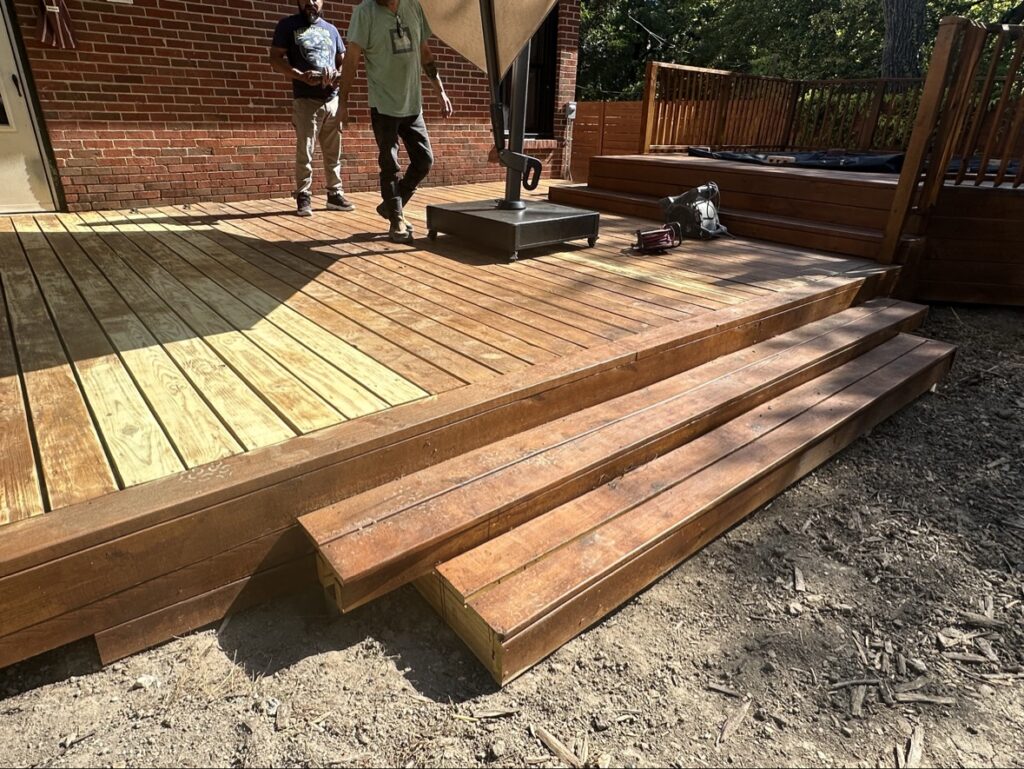 Finished multi-level stained wood deck built by deck builders in Dallas Fort Worth TX